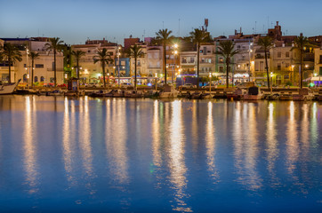 Colorful buildings on the quay of Tarragona port and light reflection in water, Spain - 123203762