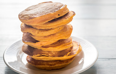 Stack of pumpkin pancakes on the plate