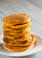 Stack of pumpkin pancakes on the plate