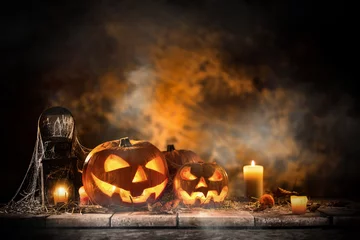 Foto op Plexiglas Halloween Pumpkins on old wooden table © Lukas Gojda