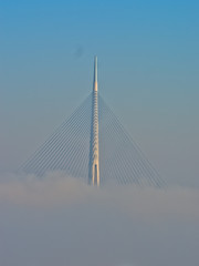 Cable bridge in fog at autumn sunny morning, Belgrade, Serbia