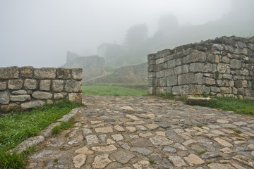 Old cobblestone path to Kalemegdan fortress covered in fog, Belgrade, Serbia