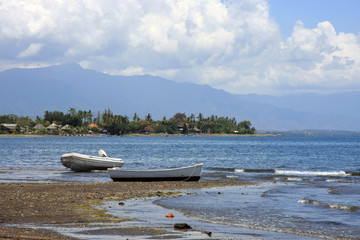 Lovina Beach in Bali, Indonesia - view of beach and sea with boa