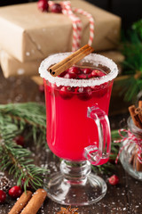 Festive Cranberry drink on Christmas background, holiday time, selective focus