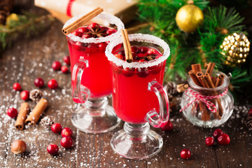 Festive Cranberry drink on Christmas background, rustic wooden table