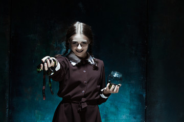 The Halloween theme: crazy girl with snakes