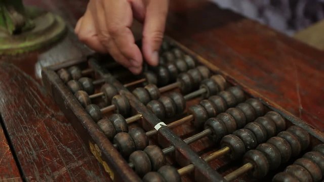 chinese abacus is a calculating tool used primarily in parts of Asia for performing arithmetic processes. The abacus was in use centuries before the adoption of the written modern numeral system.