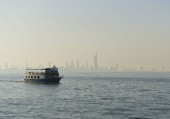 Sunset at sea in Kuwait. Landscape sea in the Persian Gulf. Boat on the sea