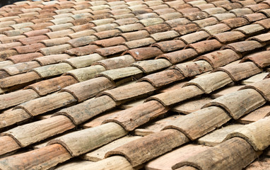 Old roof tiles on the roof of an old house