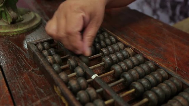 chinese abacus is a calculating tool used primarily in parts of Asia for performing arithmetic processes. The abacus was in use centuries before the adoption of the written modern numeral system.