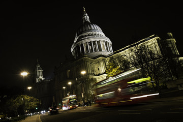London cityscape at night with St Paul's Cathedral and moving Double Decker bus