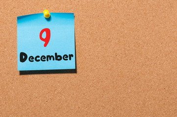 December 9th. Day 9 of month, Calendar on cork notice board. Winter time. Empty space for text