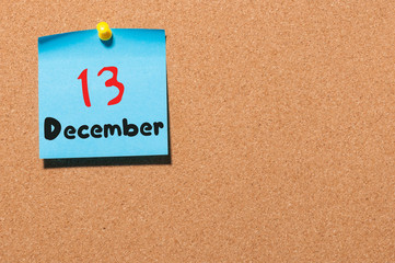 December 13th. Day 13 of month, Calendar on cork notice board. Winter time. Empty space for text