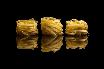 Nest pasta on black background