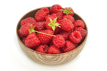 Fresh raspberries in wooden bowl isolated on white background