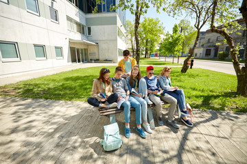 group of students with notebooks at school yard