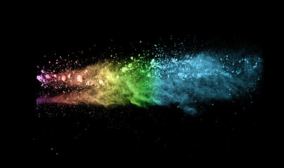 Explosion of colored powder on black background