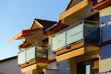Fototapeta na wymiar Balcony with glass wall in modern resort apartment