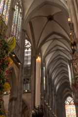 Fototapeta premium Candles in the Catholic Church, shallow depth of field