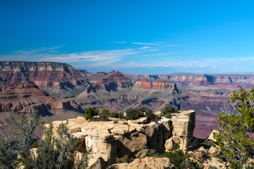 Fototapeta na wymiar Cowboy on a cliff in Grand Canyon