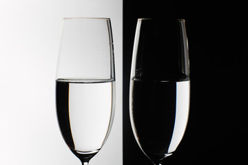 two glasses on the black and white