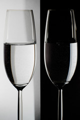 two glasses on the black and white