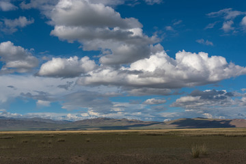 mountains steppe sky clouds