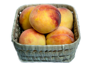 Fresh peaches in a basket
