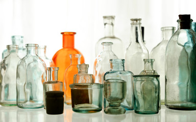 Set glass empty bottles on the shelf