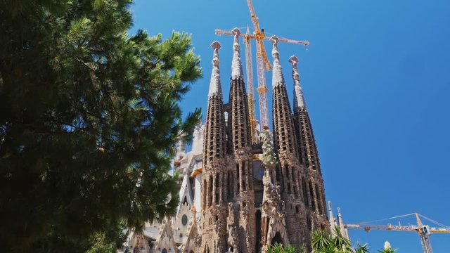 Steadicam shot: The famous temple of the Sagrada Familia in Barcelona, the camera moves in the direction of the church