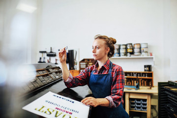 Woman working in print shop