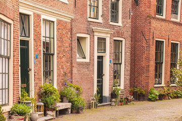 Fototapeta na wymiar View at old houses in the Dutch city of Blokzijl