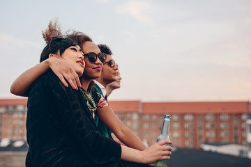 Young people relaxing on terrace