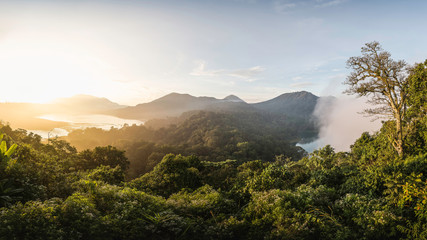 Elevated view of coast and rainforest at sunset, Wana Giri, Bali, Indonesia