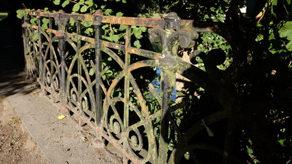 Old iron fence in a park in Antwerp