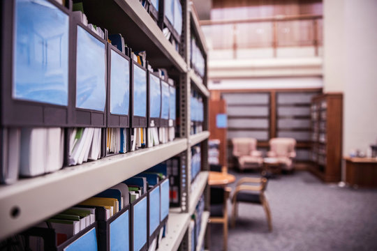 Rows of office shelves with files and paperwork