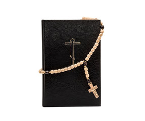 Fototapeta na wymiar Bible with rosary beads isolated on white