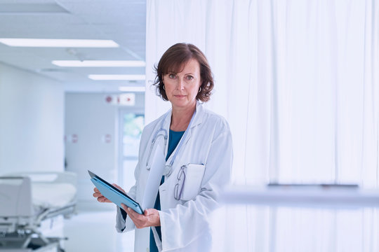 Portrait of confident female doctor in hospital ward