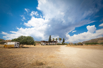 Fototapeta premium Big clouds in the sandy valley