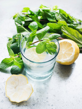 Glass of water with lemon and mint