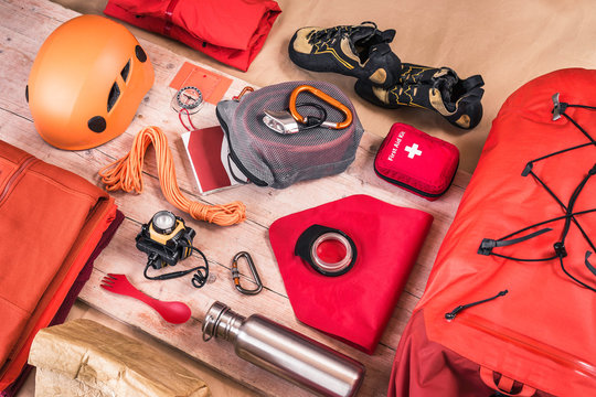 Overhead view of climbing equipment packing with first aid kit, climbing helmet, rucksack and climbing ropes