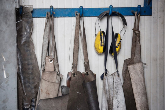 Carpenters' aprons in a row