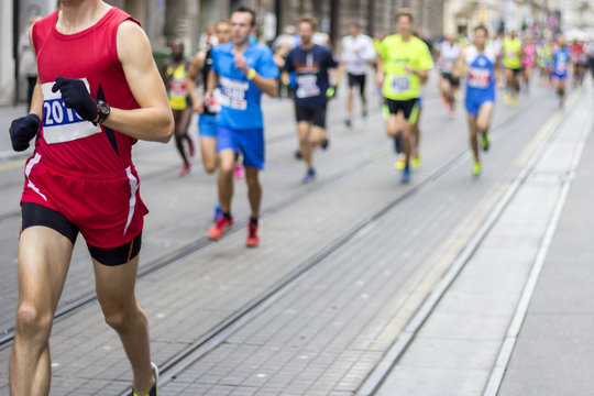 Marathon Runners Race In City Streets, Blurred Motion