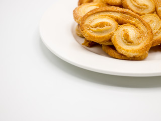 Golden and crisp palmier cookies. Pastry with sugar in a palm shape