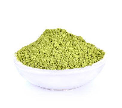 Green tea powder in white bowl on white background