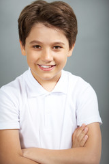 Portrait of a handsome boy looking at camera and smiling