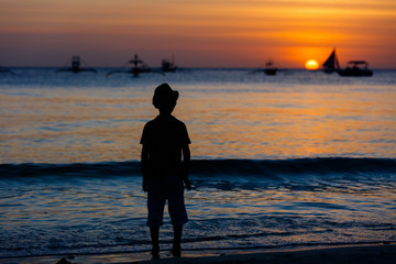 Silhouette of child on the beach