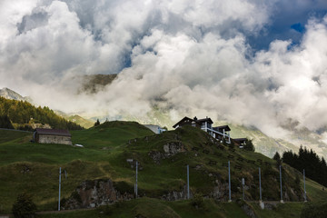 Idyllic summer landscape in the Alps with fresh green mountain