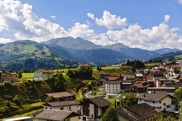 Fototapeta premium Idyllic summer landscape in the Alps with fresh green mountain