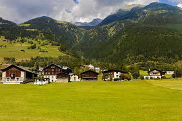 Fototapeta na wymiar Idyllic summer landscape in the Alps with fresh green mountain
